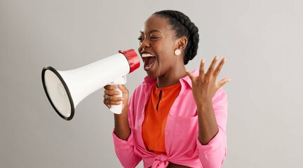 Megaphone, shout and excited black woman on gray background for news, announcement and information....