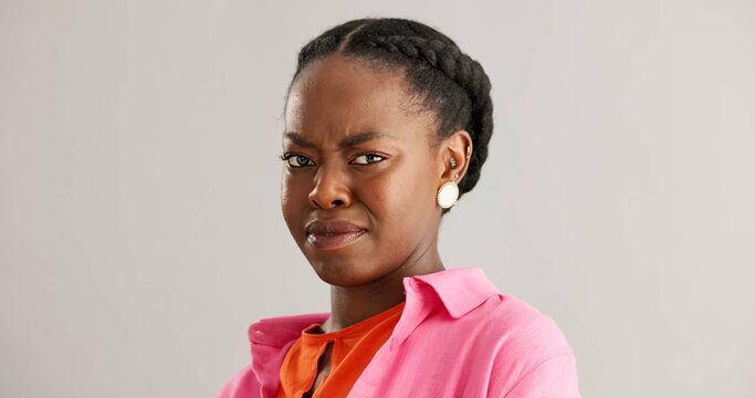 Woman, african and face with studio, disgust and cringe with reaction to news. Person, upset and gossip with emotion, wtf and negative or unhappy with omg look and unexpected notification and fail