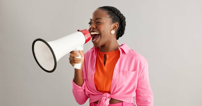 Megaphone, excited and black woman on gray background for news, announcement and information. Bullhorn, communication and person with speaker for discount, sale and bargain broadcast in studio