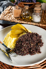 Fried black pudding with mashed potatoes.