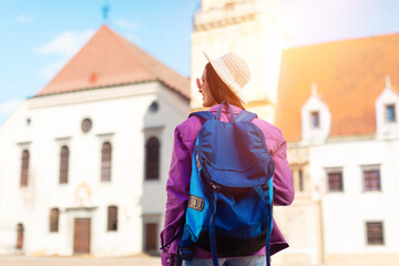 Solo traveler with map in historic European town