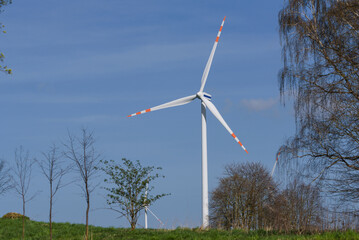 
WIND FARM - Turbines in a sunny weather landscape
