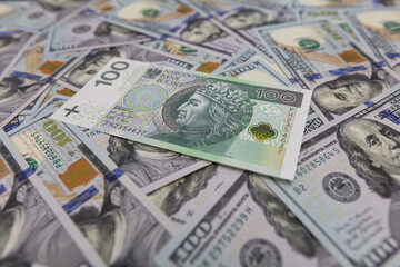 100 US  dollar and 100 polish zloty banknotes