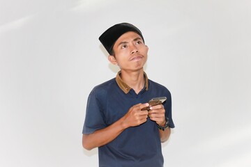 Young Asian Entrepreneur Who Is Thinking About a Good Marketing Strategy for His Business