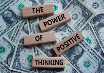 Positive Thinking symbol. Wooden blocks with words The Power of Positive Thinking. Beautiful dollar...