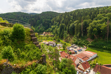 Fototapeta premium Ruins of Wolfsberg Castle and village Wolfsberg panorama view near Obertrubach in Franconian Switzerland, Germany