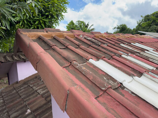 Damaged tiled house roof