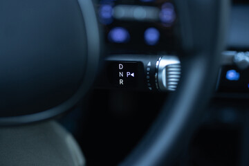 Handle of electric car gearbox control. Design details of minimalist concept of electric car....