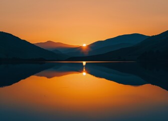 Fototapeta na wymiar Sun Setting Over Lake With Mountains in Background