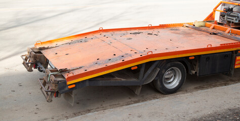 Tow truck in the city. Transportation of broken-down cars.