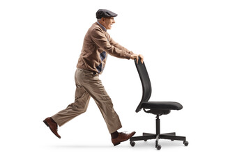 Excited elderly man pushing an office chair
