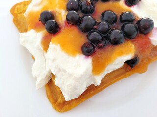Delicious dessert with black currant, jam and protein cream.