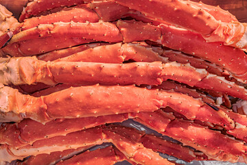 Big pile of crab legs in a market. Luxurious heap of snow crab legs.  © LRafael