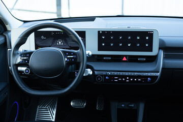 Electric car interior luxury. Interior of prestige modern car. Leather comfortable seats, dashboard...