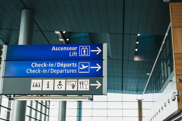 Directional signs to facilities in an airport.