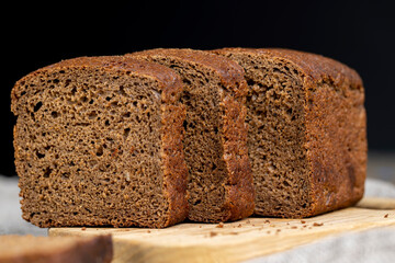 rectangular loaf of bread on a linen cloth
