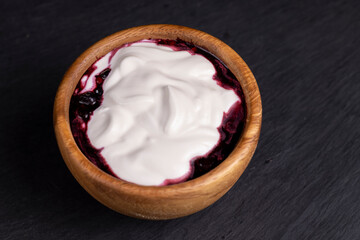 fresh creamy yogurt with berries and blueberry jam