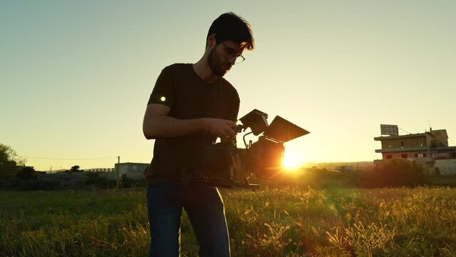 filmmaker in action at sunset light 