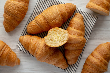 Homemade Breakfast Croissants on a Wooden Board, top view. Flat lay, overhead, from above. - 785703736