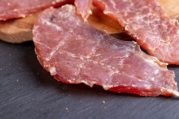 dried pork meat with spices and salt on the table