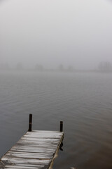 foggy day on the lake in winter season