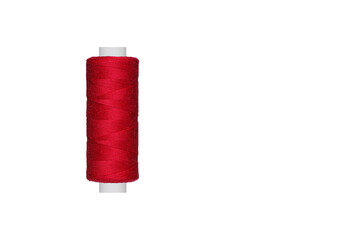 Red spool of sewing thread isolated on white background