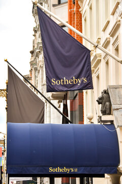 London, England, UK - 27 June 2023: Flag and canopy above the entrance to the Sotheby's autcion house in New Bond Street in central London