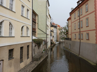 Fototapeta na wymiar Building exterior and water canal in Prague, Czech republic