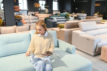 Obraz premium young woman shopping for furniture, sofa and home decor in store