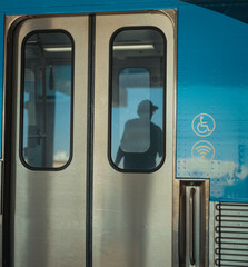 train in the subway reflection window man 