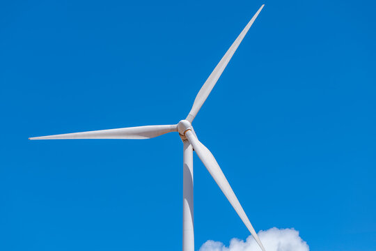 Wind turbine against clear blue sky