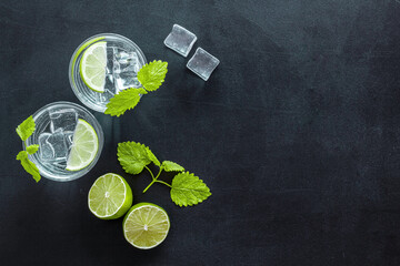 Refreshing cold cocktail with mint in glasses, top view