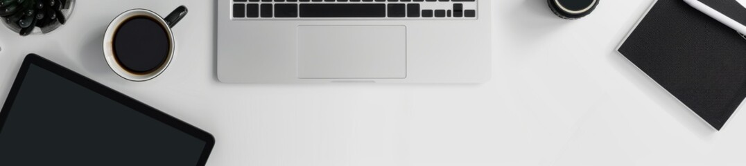 Black coffee cup, laptop, tablet, notebook, green plant on white table in modern workspace. A modern workspace with a black coffee cup, closed laptop, tablet, and notebook on a white table. 