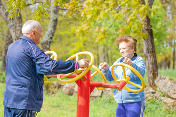 senior couple practicing exercise outdoors - 785744727