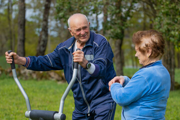 senior couple practicing exercise outdoors - 785744781