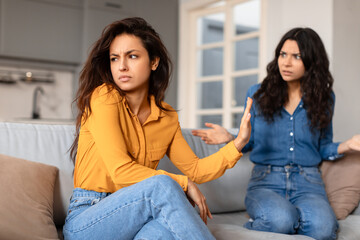 Tense discussion between two girlfriends at home