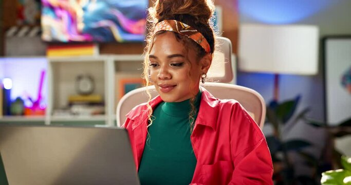 Laptop, web design and creative business woman in office for online research, website and internet. Night, graphic designer and person on computer for planning, programming and software interface