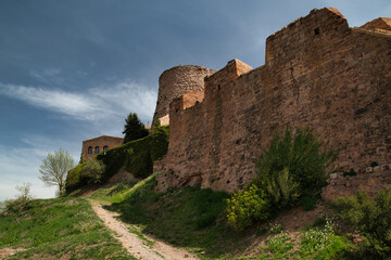 Fototapeta na wymiar Photos of the exterior of the Castle of Cardona was built in 886 in Romanesque and Gothic style, located on a hill. Catalonia, Spain