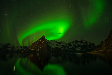 Polar light on Lofoten islands. Aurora in arctic side. Night light on the coast of Atlantic ocean. 