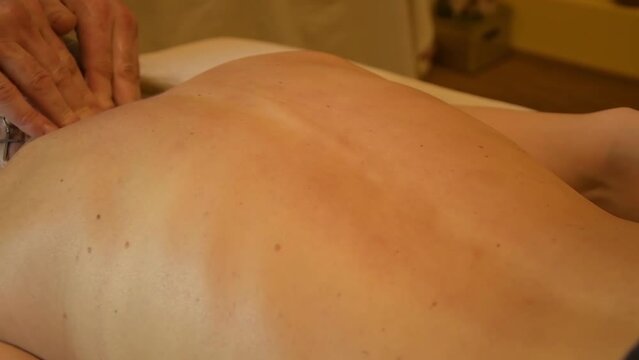Back and spinal massage for a woman.