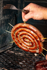 chorizo argentino on the grill, Salchica asada, roast sausage