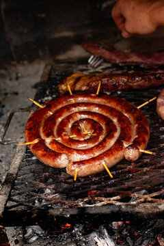 chorizo argentino on the grill, Salchica asada, roast sausage