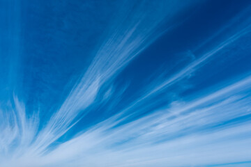Beautiful sky with cirrus or white clouds on blue background