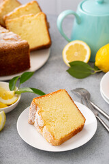 Lemon pound cake baked in a bundt pan topped with powdered sugar