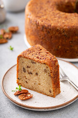 Pecan caramel pound cake baked in a bundt pan slice on a plate