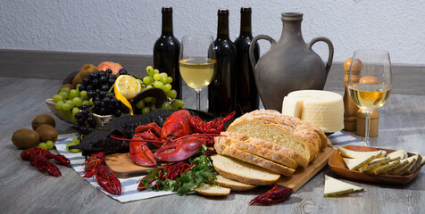 Fototapeta premium Still life with tasty seafood, wine, cheese and bread on table