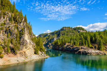 View of the Pend Oreille River and Washington Rock from the Metaline Falls Bridge on State Route 31 in the small Northeastern town of Metaline Falls, Washington.	