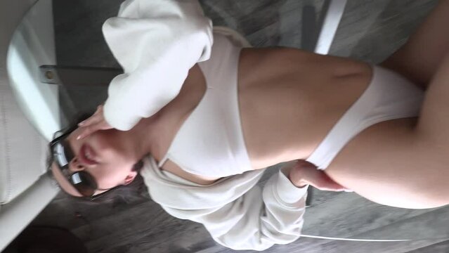 CFC2022VV  Ukrainian female model in casual setting dressed in white lingerie 4K in vertical format