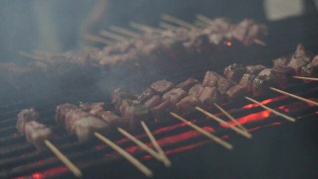 Saikoro is skewered using a skewer and grilled with charcoal