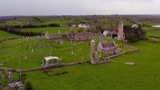 Serene aerial orbit captures the ancient ruins and serene landscape of Clonmacnoise Monastic Site. Offaly